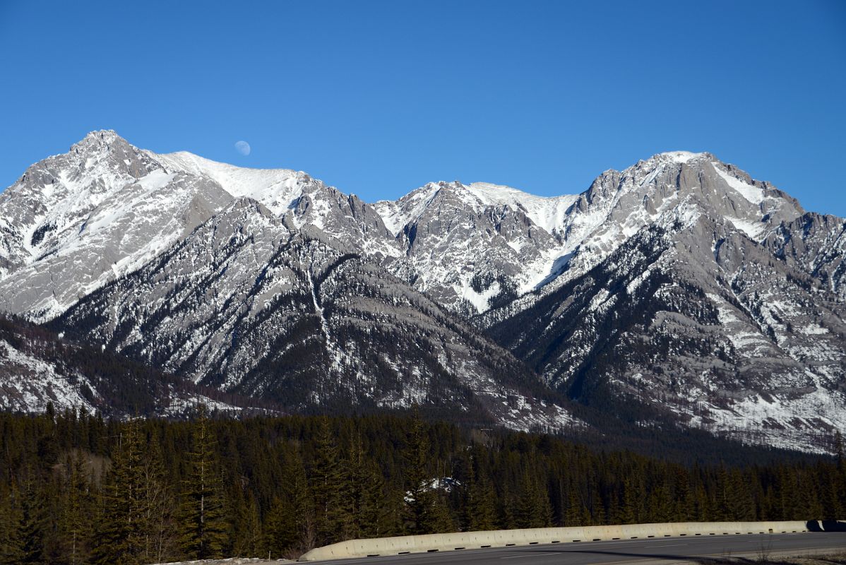 26B Cockscomb Mountain, The Finger With Moon Afternoon From Trans Canada Highway Driving Between Banff And Lake Louise in Winter